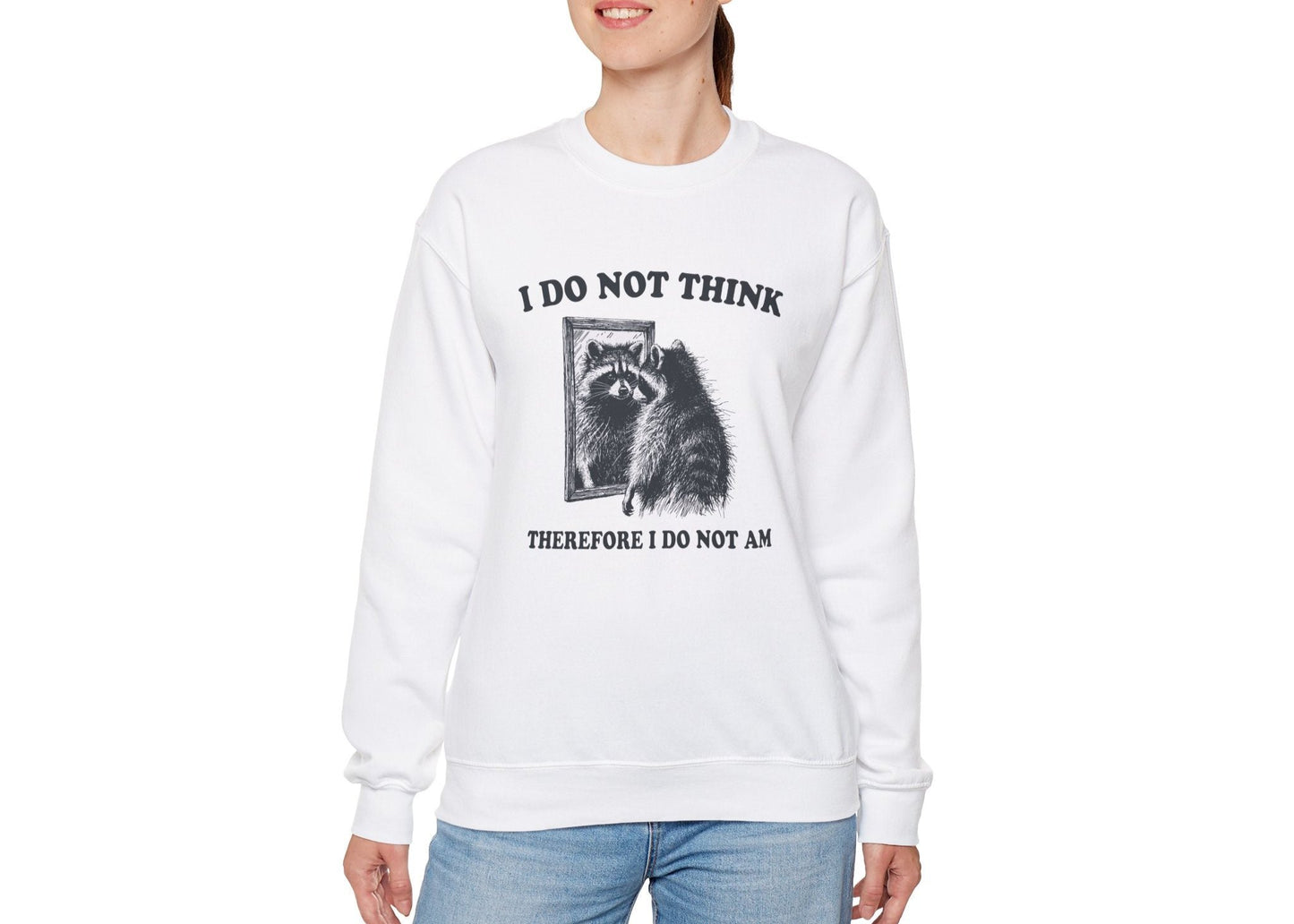 Model wearing a white sweater jumper with the text "I Do Not Think, Therefore I Do Not Am" and a cartoon raccoon illustration. Part of the Vivid Divergence Sensory Friendly Unisex Sweater Jumper Range.