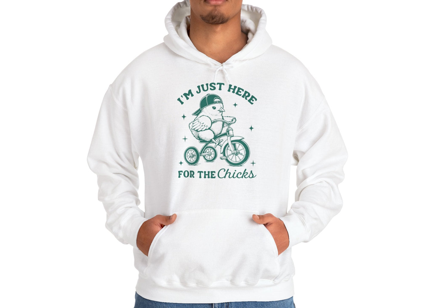 Man wearing white hoodie with “I’m Just Here For The Chicks” Easter design. Part of the Vivid Divergence Sensory Friendly Unisex Hoodies Range.