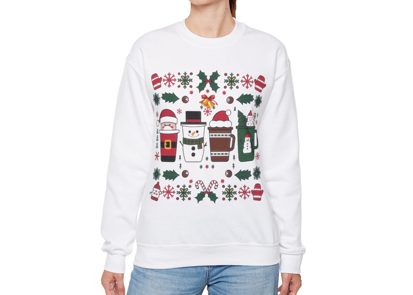 Model seated in a cozy setting wearing a white sweatshirt featuring a festive holiday pattern with coffee cups, snowflakes, and Christmas elements. Part of the Vivid Divergence Sensory Friendly Unisex Sweater Jumper Range.