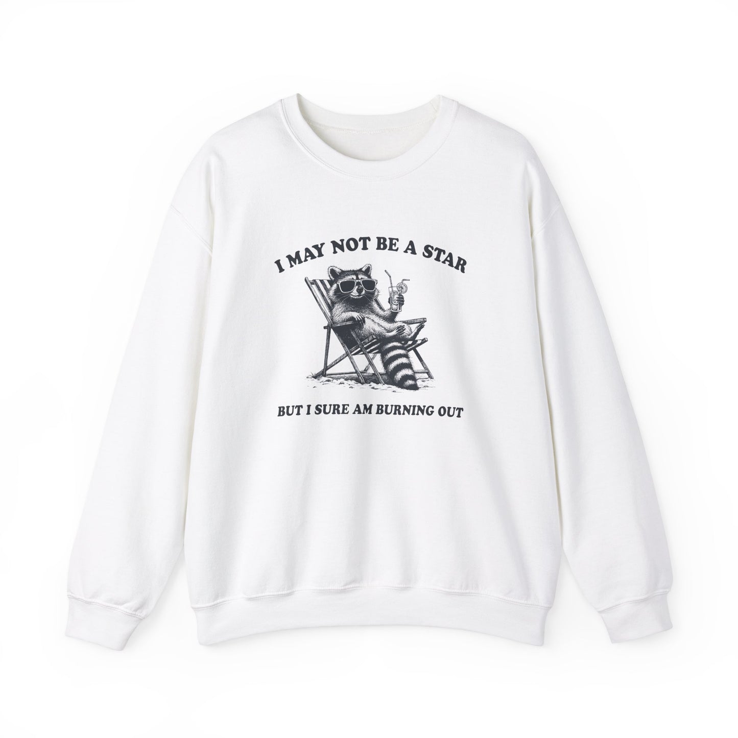 Front view of a white sweatshirt featuring a raccoon sitting in a trash can with the text "I May Not Be A Star, But I Sure Am Burning Out." Part of the Vivid Divergence Sensory Friendly Unisex Sweater Jumper Range.