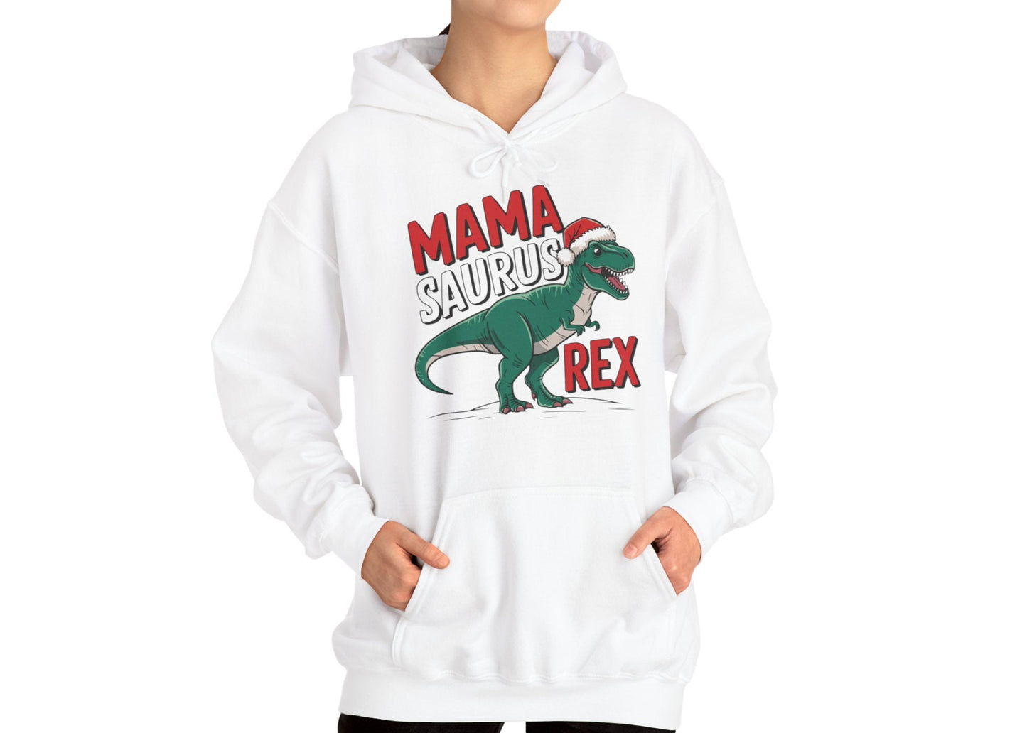 Model wearing a white hoodie featuring a "Mama-Saurus Rex" design with a festive dinosaur illustration, styled casually. Part of the Vivid Divergence Sensory Friendly Unisex Hoodie Range.