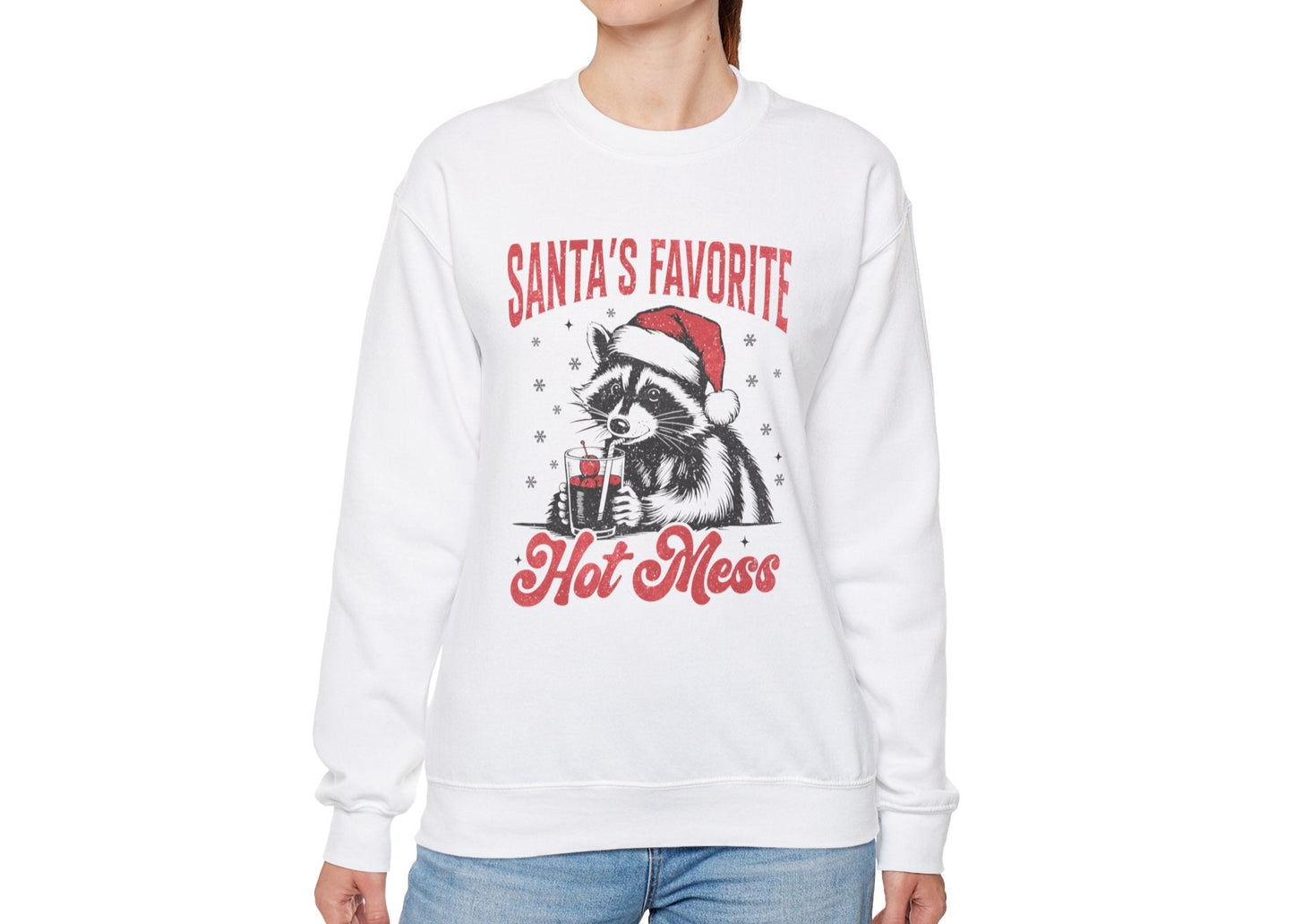 Another model wearing a white sweatshirt featuring a "Santa's Favorite Hot Mess" design with a festive raccoon wearing a Santa hat. Part of the Vivid Divergence Sensory Friendly Unisex Sweater Jumper Range.