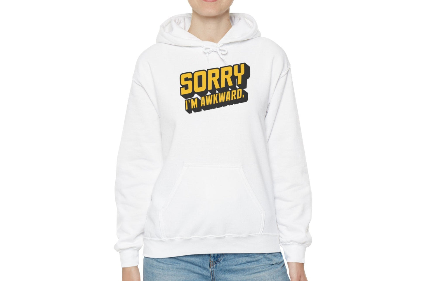 Model wearing a white hoodie featuring the text "Sorry I'm Awkward" in bold yellow and white lettering. Part of the Vivid Divergence Sensory Friendly Unisex Hoodie Range.