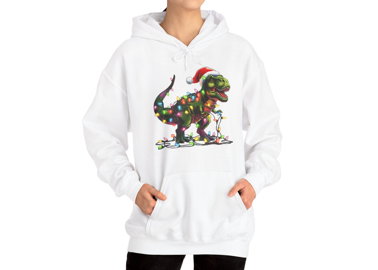 Model wearing a white hoodie with a T-Rex tangled in Christmas lights, wearing a Santa hat. Part of the Vivid Divergence Sensory Friendly Hoodie Range.