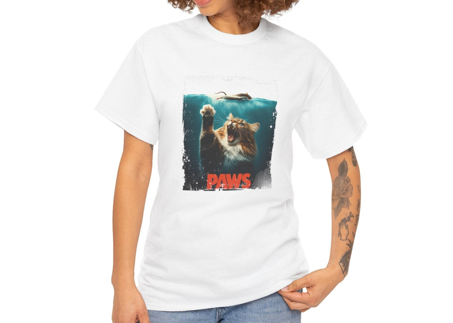 White T-shirt with a "Paws" parody of the movie Jaws featuring a cat underwater, modeled on a person. Part of the Vivid Divergence Sensory Friendly Unisex Tees Range.