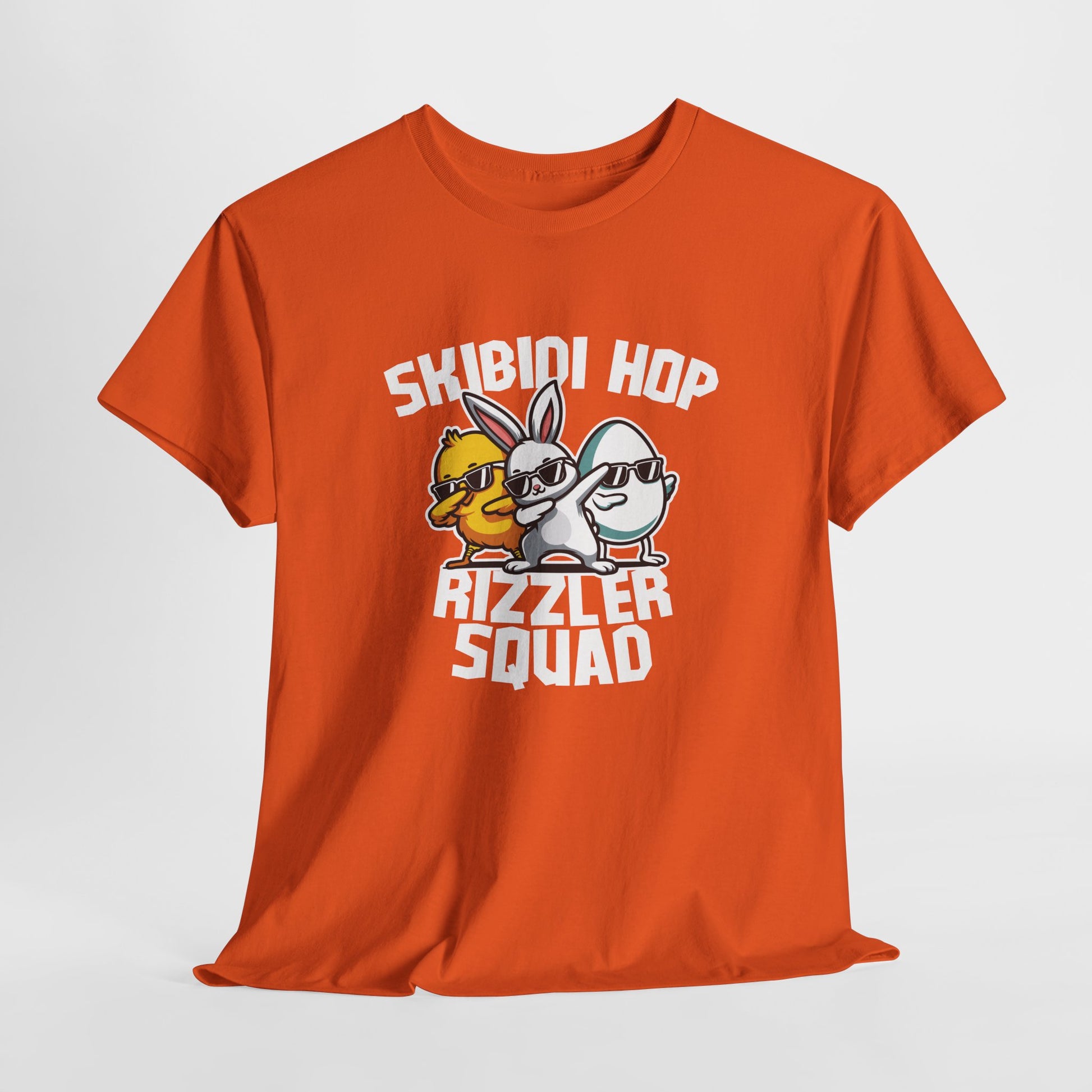 Hanging view of an orange Skibidi Rizzler Squad T-shirt with a skibidi sigma Easter design featuring rizzed-up bunny and chick duo. A playful meme-inspired Easter tee. Part of the Vivid Divergence Sensory Friendly Unisex Tees Range.