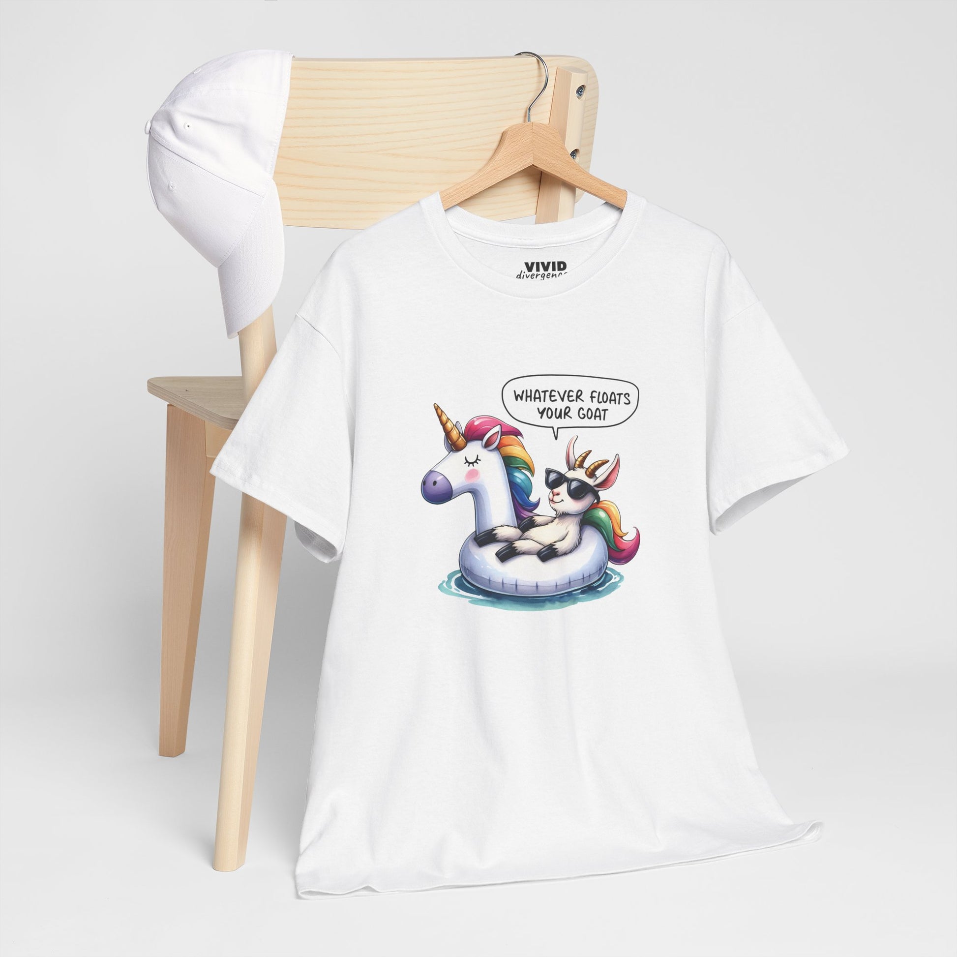 White meme T-shirt draped over a chair showing goat in unicorn floatie graphic and playful phrase. For your most ungovernable moods. Part of the Vivid Divergence Memewear Collection!
