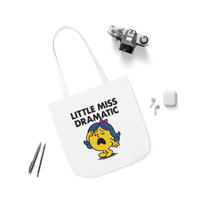 Flat lay of tote bag featuring Little Miss Dramatic surrounded by accessories. She just saw a text with “...” and is spiraling. Part of the Vivid Divergence Little Miss Meme Collection!
