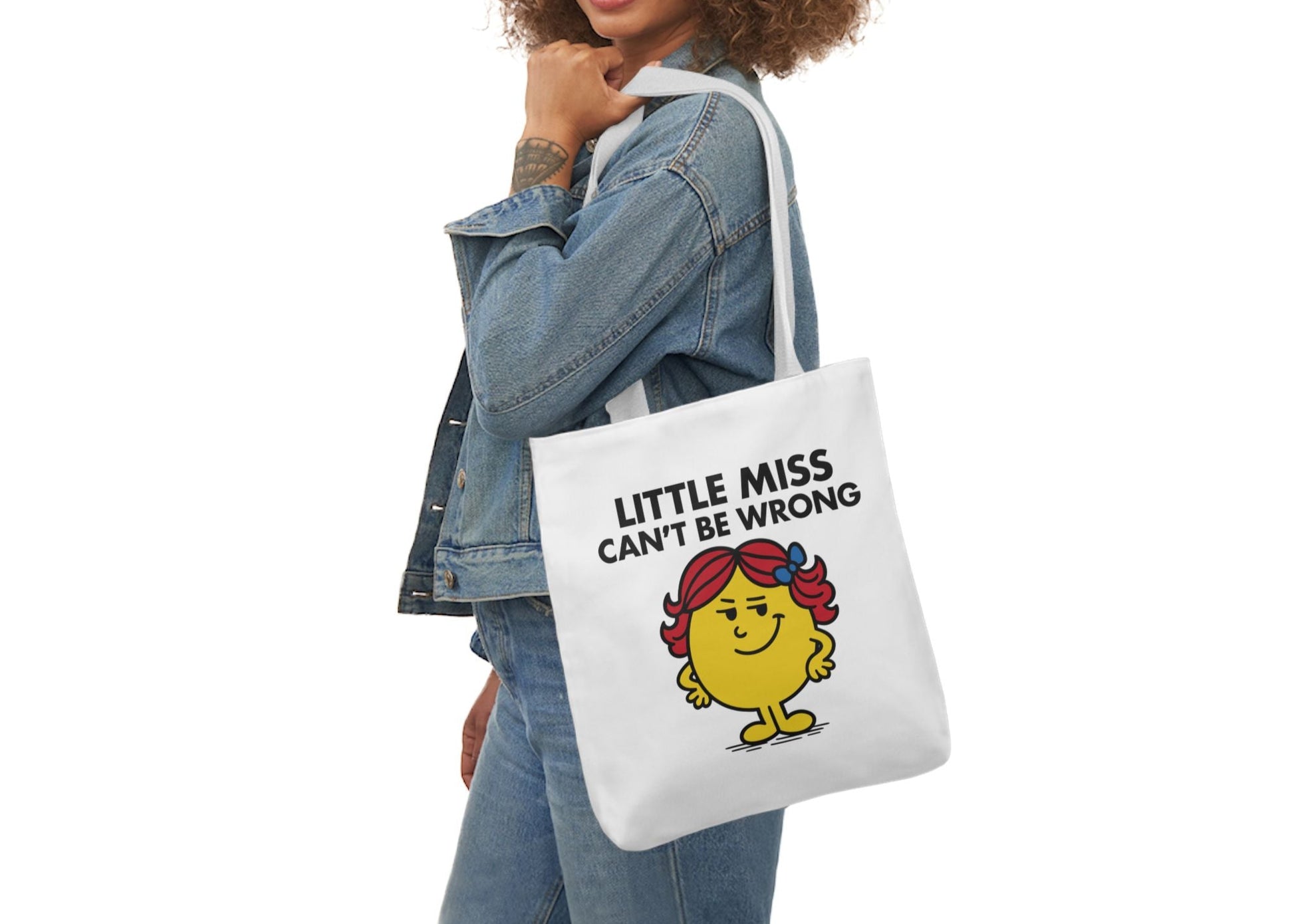 Woman in a denim outfit wearing the Little Miss Can’t Be Wrong tote over her shoulder, serving confidence and zero apologies. Part of the Vivid Divergence Little Miss Meme Collection!
