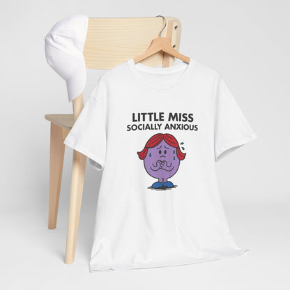 Little Miss Socially Anxious T-shirt draped over a wooden chair in a bright setup. Part of the Little Miss Meme Character Collection. A Vivid Divergence Sensory Friendly Unisex Tee.
