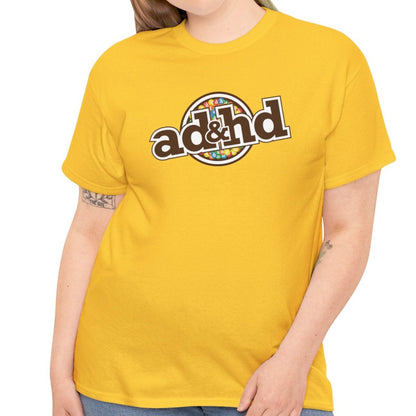Woman Wearing Unisex ADHD m&m Brand Parody T-Shirt in Daisy Yellow. Part of the Vivid Divergence Range. Everyday Products That Celebrate Your Neurospicy.