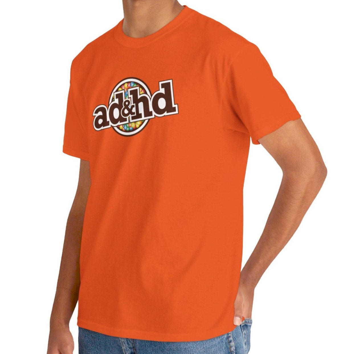 Man wearing Unisex ADHD m&m Brand Parody T-Shirt in Orange. Part of the Vivid Divergence Range. Everyday Products That Celebrate Your Neurospicy.