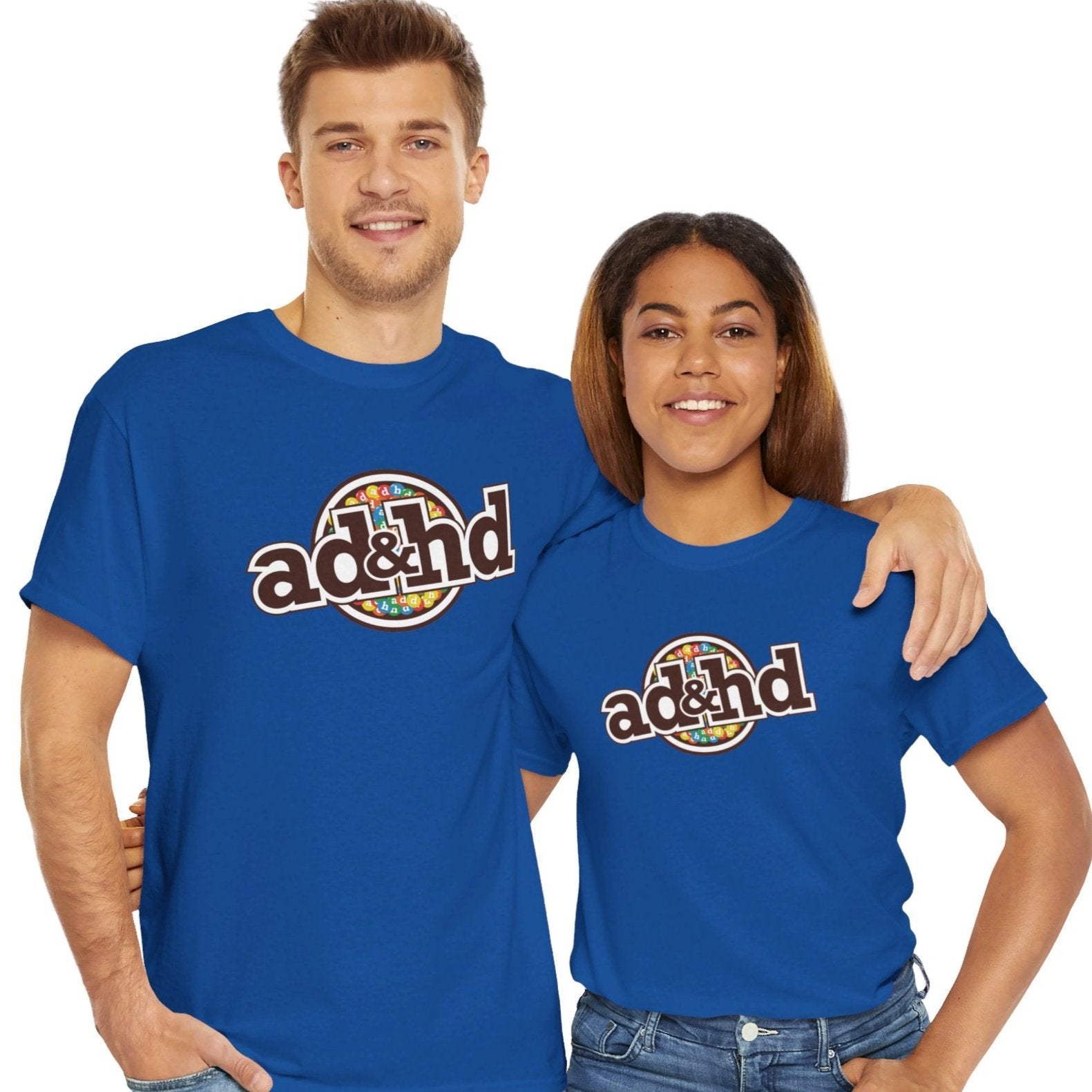 Man and Woman wearing Unisex ADHD m&m Brand Parody T-Shirt in Royal Blue. Part of the Vivid Divergence Range. Everyday Products That Celebrate Your Neurospicy.