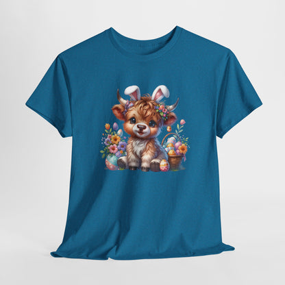 Antique Sapphire T-shirt hanging, featuring an adorable Highland cow with bunny ears surrounded by Easter eggs and flowers, a festive springtime design. Hop into the season in style and shop Easter shirts online today!