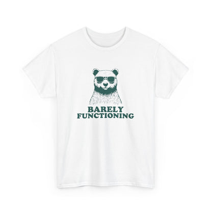 Front view of a white T-shirt with a green bear graphic and "Barely Functioning" text. Part of the Vivid Divergence Sensory Friendly Unisex Tees Range.