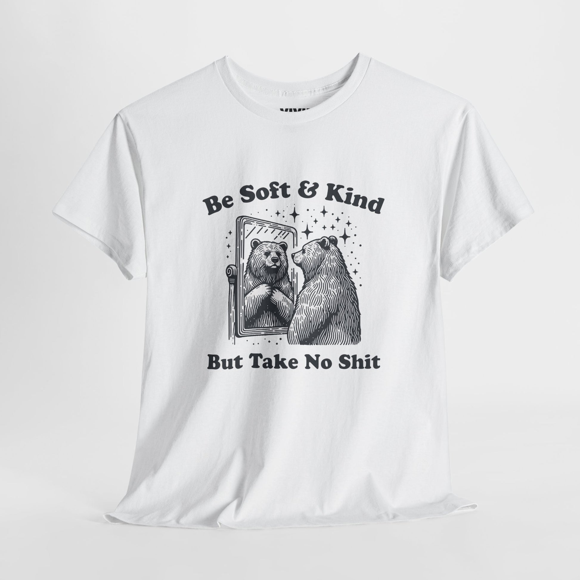 Hanging view of white T-shirt featuring sketched bear standing tall with the phrase "Be Soft & Kind But Take No Shit." Equal parts gentle and feral. Part of the Vivid Divergence Memewear Collection!
