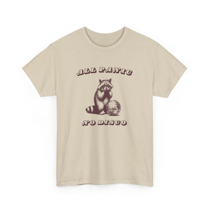 Front view of a beige T-shirt featuring the text "All Panic No Disco" with a raccoon illustration. Part of the Vivid Divergence Sensory Friendly Unisex Tees Range.