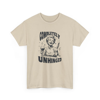 Model wearing a beige T-shirt with "Completely Unhinged" text and graphic design. Part of the Vivid Divergence Sensory Friendly Unisex Tees Range.