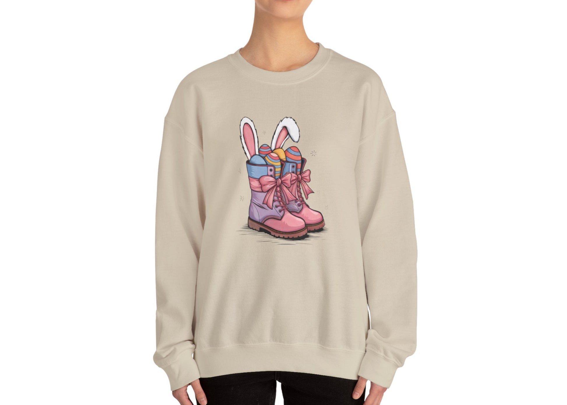Woman in beige sweater jumper with pink cowgirl boots, bunny ears, and Easter eggs. Part of the Vivid Divergence Sensory Friendly Unisex Sweater Jumper Range.
