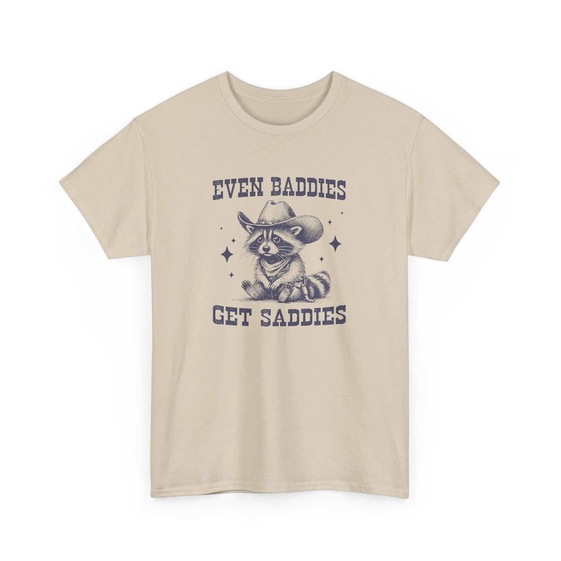 Front view of a beige T-shirt with the text "Even Baddies Get Saddies" and a crying eye graphic. Part of the Vivid Divergence Sensory Friendly Unisex Tees Range.