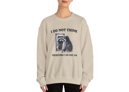 Model wearing a beige sweater jumper with the text "I Do Not Think, Therefore I Do Not Am" and a cartoon raccoon illustration. Part of the Vivid Divergence Sensory Friendly Unisex Sweater Jumper Range.