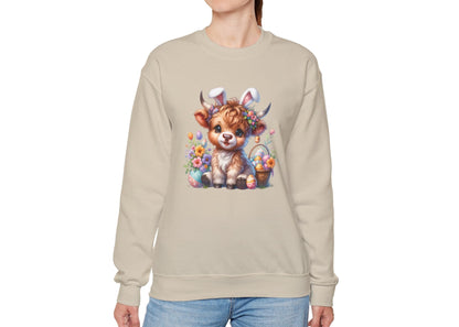 Woman modeling beige sweater jumper with Highland cow and Easter eggs artwork. Part of the Vivid Divergence Sensory Friendly Unisex Sweater Jumper Range.
