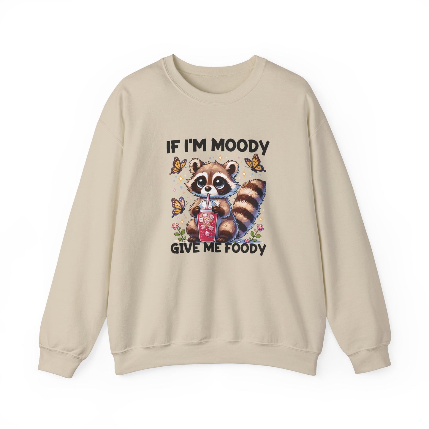 Front view of a beige sweater jumper with the text "If I'm Moody, Give Me Foody" and a cartoon raccoon illustration holding snacks. Part of the Vivid Divergence Sensory Friendly Unisex Sweater Jumper Range.