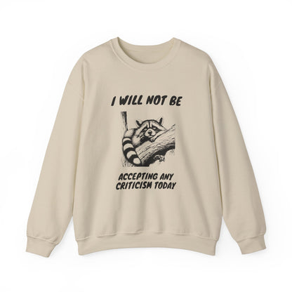 Front view of a beige sweater jumper with the text "I Will Not Be Accepting Any Criticism Today" and a cartoon illustration of a hand with a raised finger. Part of the Vivid Divergence Sensory Friendly Unisex Sweater Jumper Range.