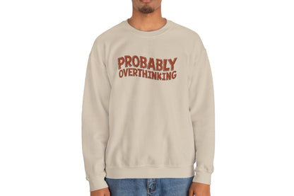 Model wearing a beige sweater jumper with the text "Probably Overthinking" in bold red lettering. Part of the Vivid Divergence Sensory Friendly Unisex Sweater Jumper Range.