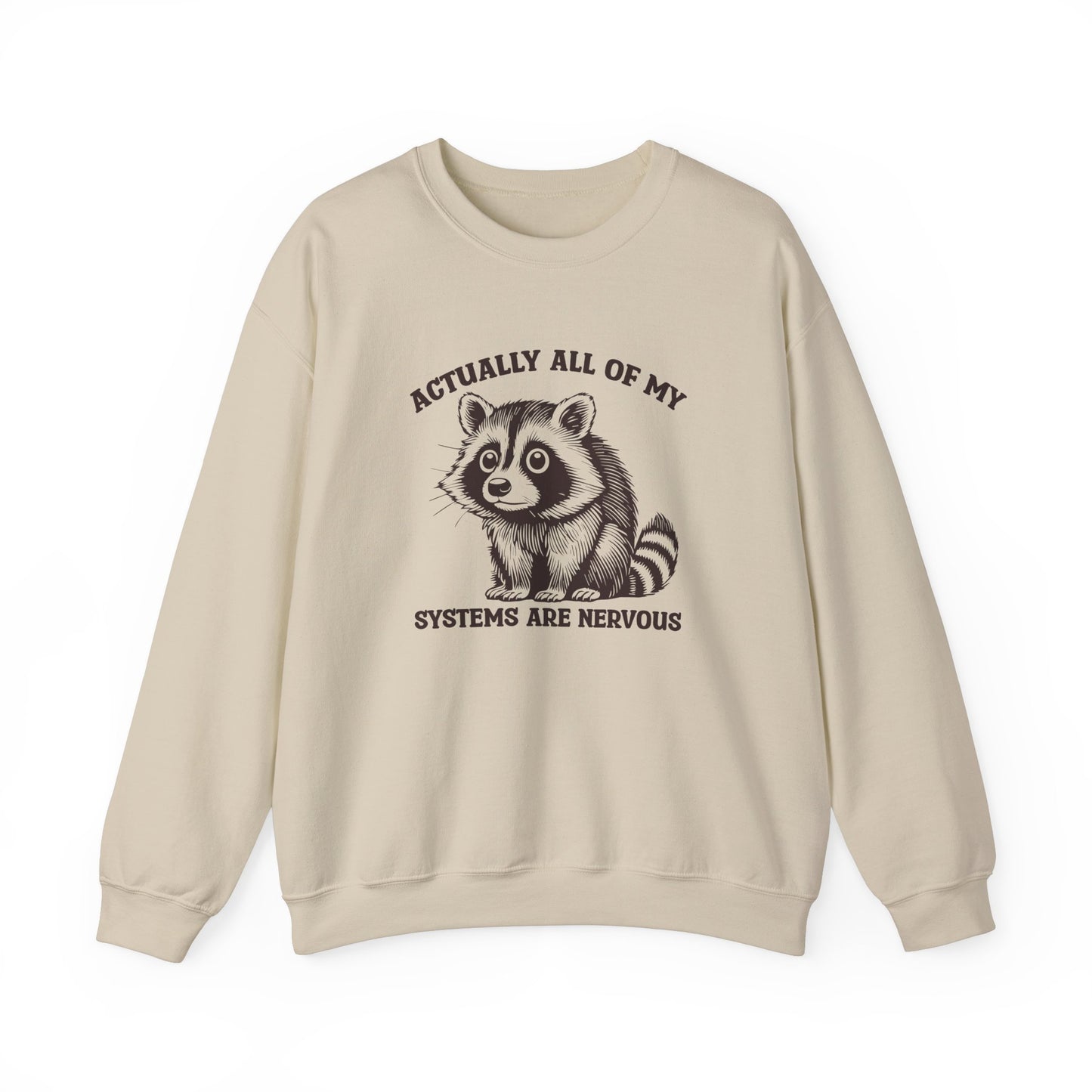 Front view of a beige sweatshirt featuring a raccoon graphic and the text "Actually All of My Systems Are Nervous." Part of the Vivid Divergence Sensory Friendly Unisex Sweater Jumper Range.