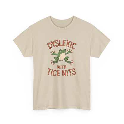 Beige T-shirt with a green frog graphic and the text "Dyslexic with Tice Nits," front view. Part of the Vivid Divergence Sensory Friendly Unisex Tees Range.