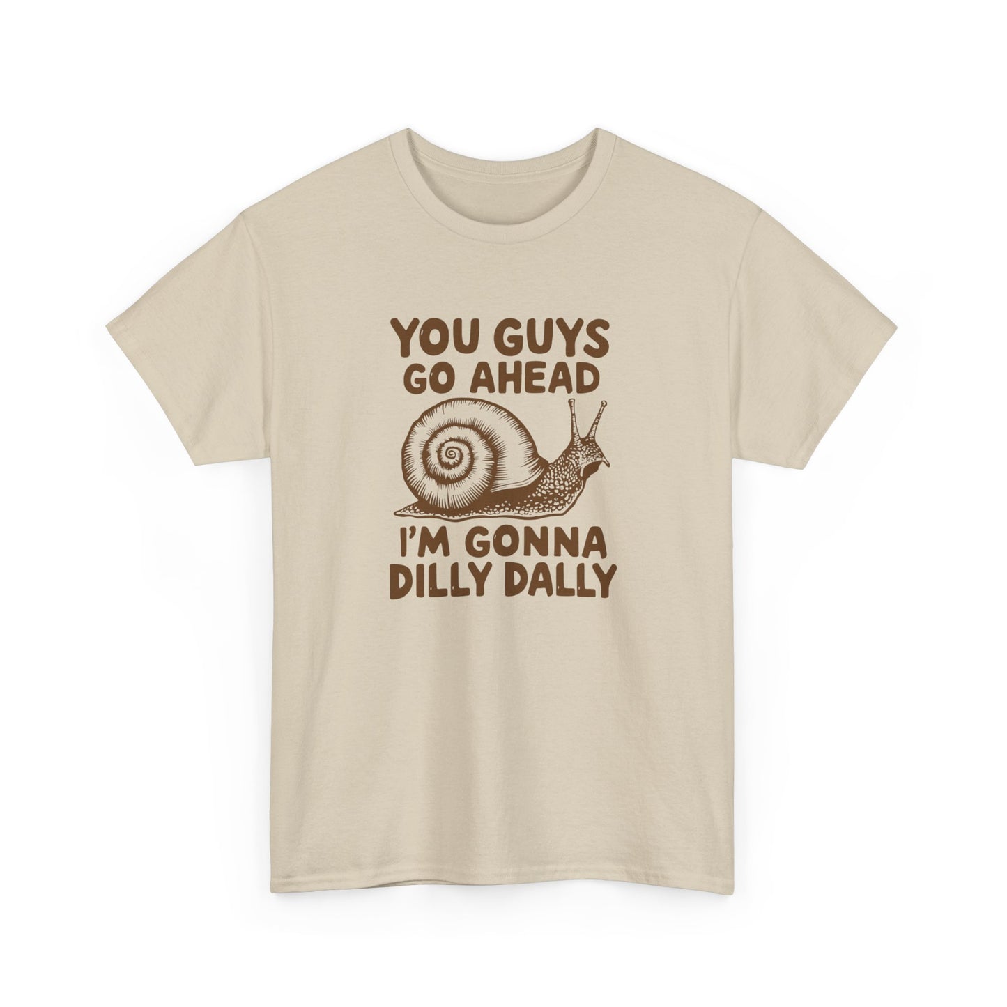 Front view of a beige T-shirt with the text "You Guys Go Ahead, I'm Gonna Dilly Dally" and a playful snail graphic in brown. Part of the Vivid Divergence Sensory Friendly Unisex Tees Range.