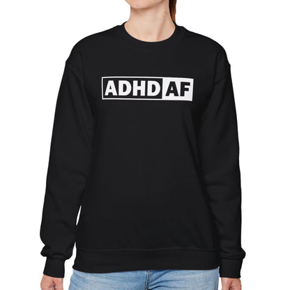 Model wearing a black sweater jumper with "ADHD AF" text in bold white lettering. Part of the Vivid Divergence Sensory Friendly Unisex Sweater Jumper Range.