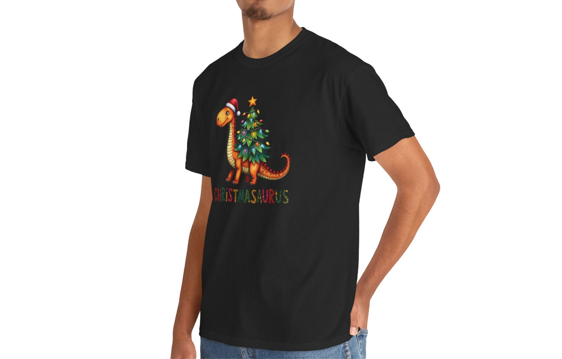 Model wearing a black T-shirt featuring a festive dinosaur decorated as a Christmas tree with ornaments and lights, styled casually for the holiday season. Part of the Vivid Divergence Sensory Friendly Unisex Tees Range.