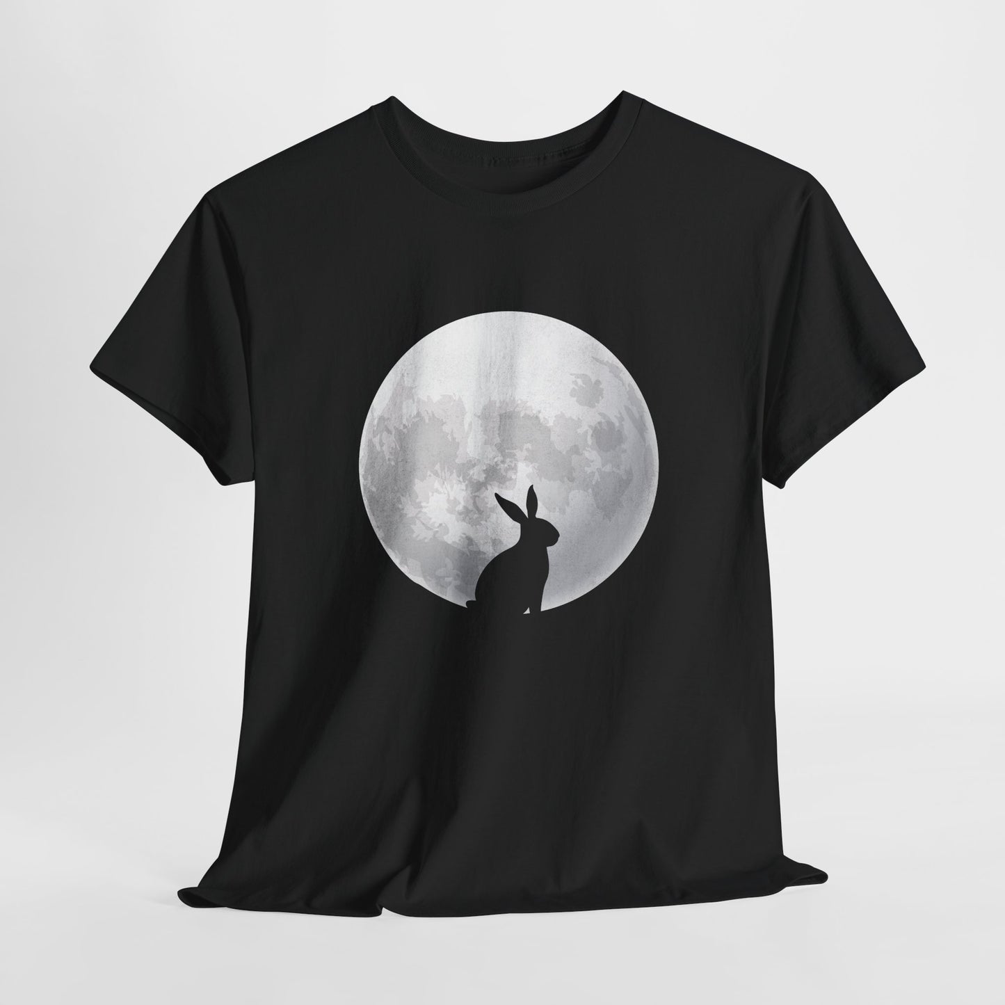 Black T-shirt hanging, featuring a minimalist silhouette of a rabbit against a glowing full moon, perfect for lovers of folklore and moon magic. Hop into the season in style and shop Easter shirts online today!