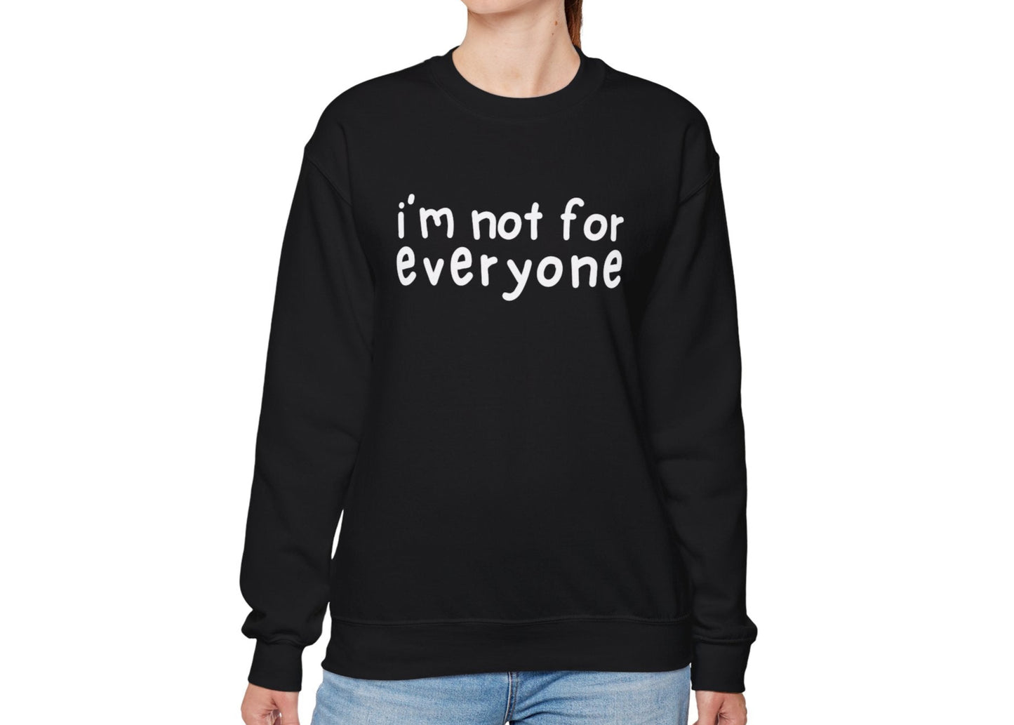Model wearing a black sweater jumper with the text "I'm Not For Everyone" in bold white lettering. Part of the Vivid Divergence Sensory Friendly Unisex Sweater Jumper Range.
