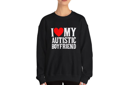 Model wearing a black sweater jumper with the text "I ❤️ My Autistic Boyfriend" in bold white and red lettering. Part of the Vivid Divergence Sensory Friendly Unisex Sweater Jumper Range.