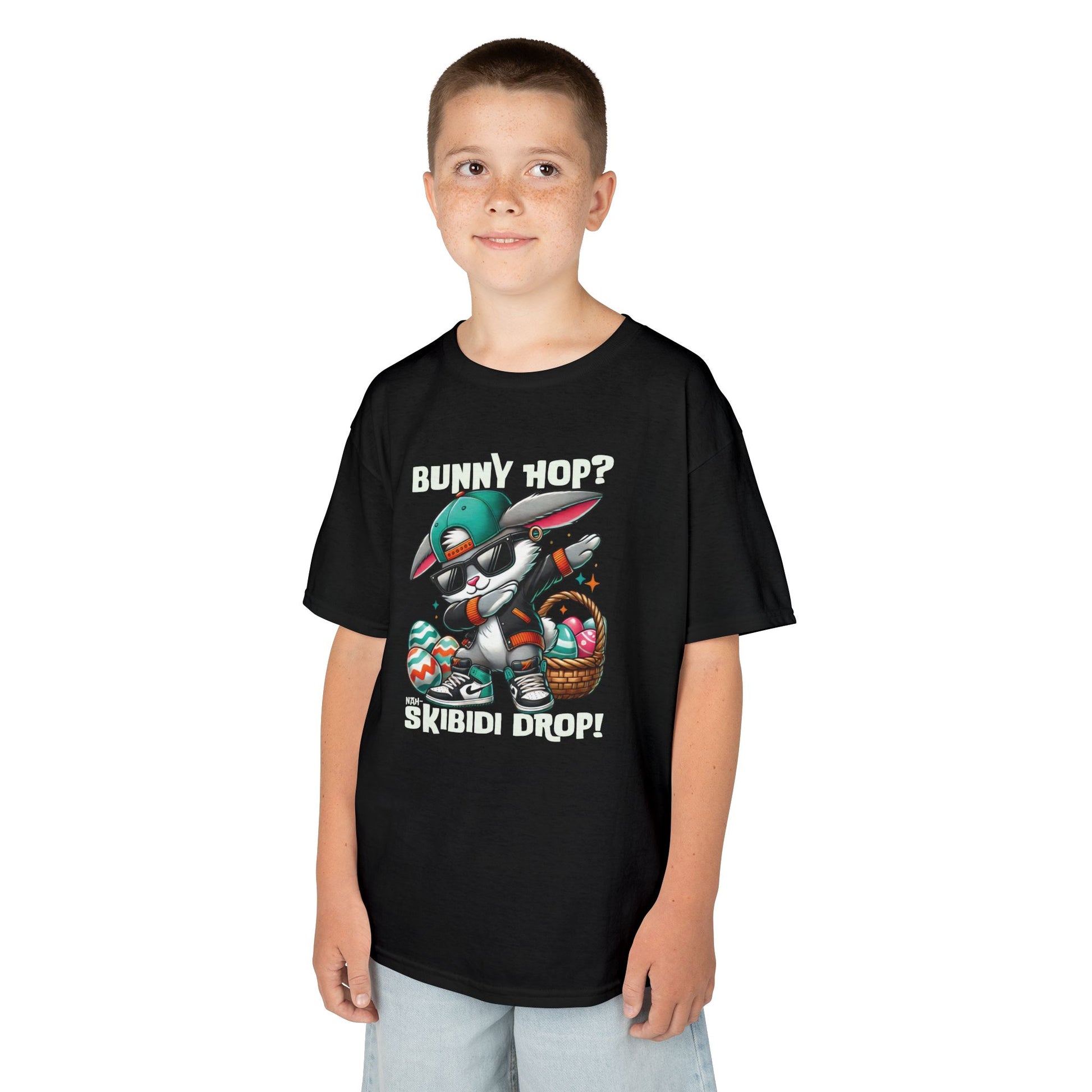 Black Easter T-shirt worn by a boy, featuring skibidi bunny and fun text. A fun, bold shirt radiating skibidi sigma rizz energy for Easter. Hop into the season in style and shop Easter shirts online today!
