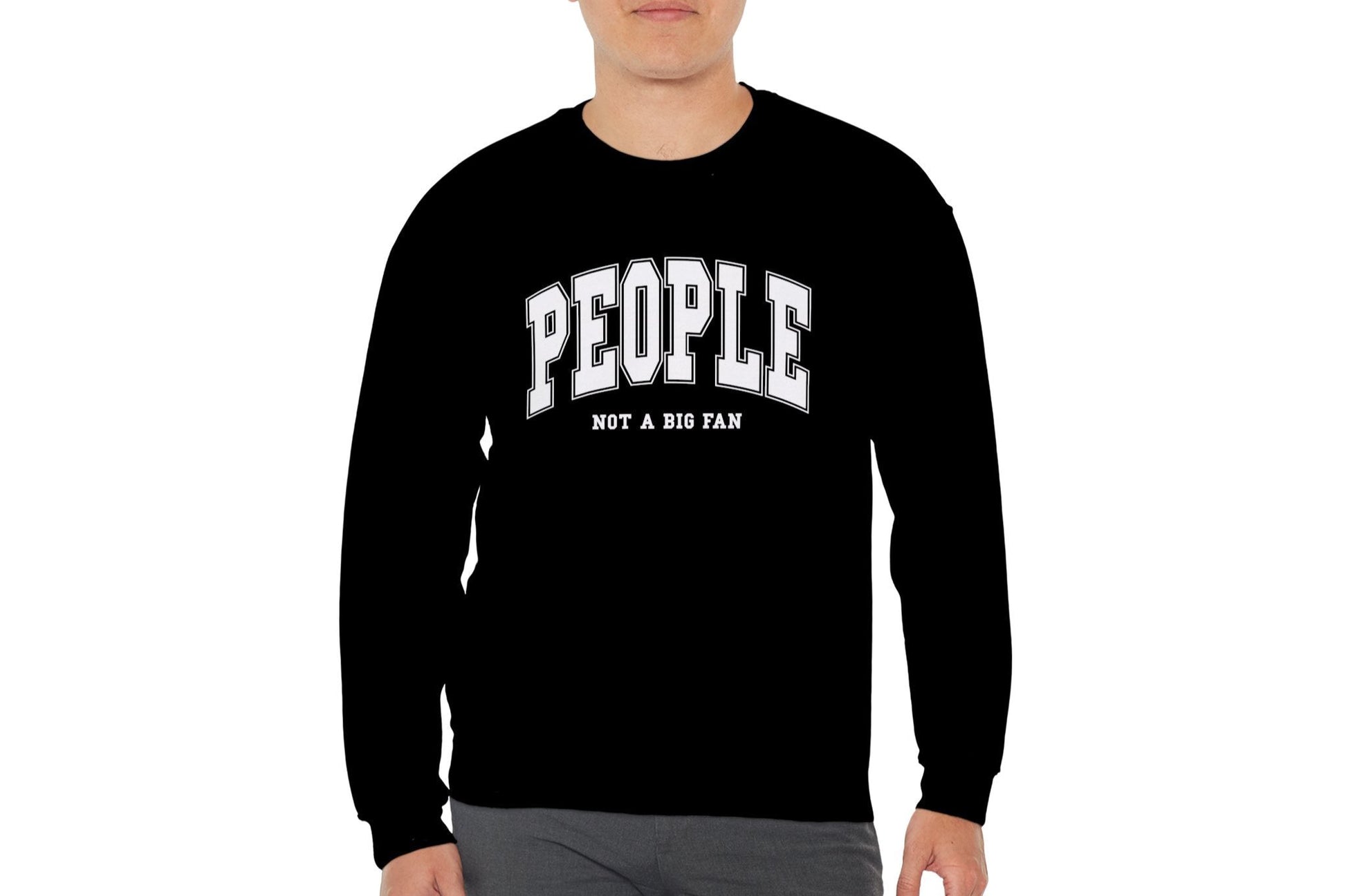 Model wearing a black sweater jumper with the text "People. Not a Big Fan" in bold white lettering. Part of the Vivid Divergence Sensory Friendly Unisex Sweater Jumper Range.