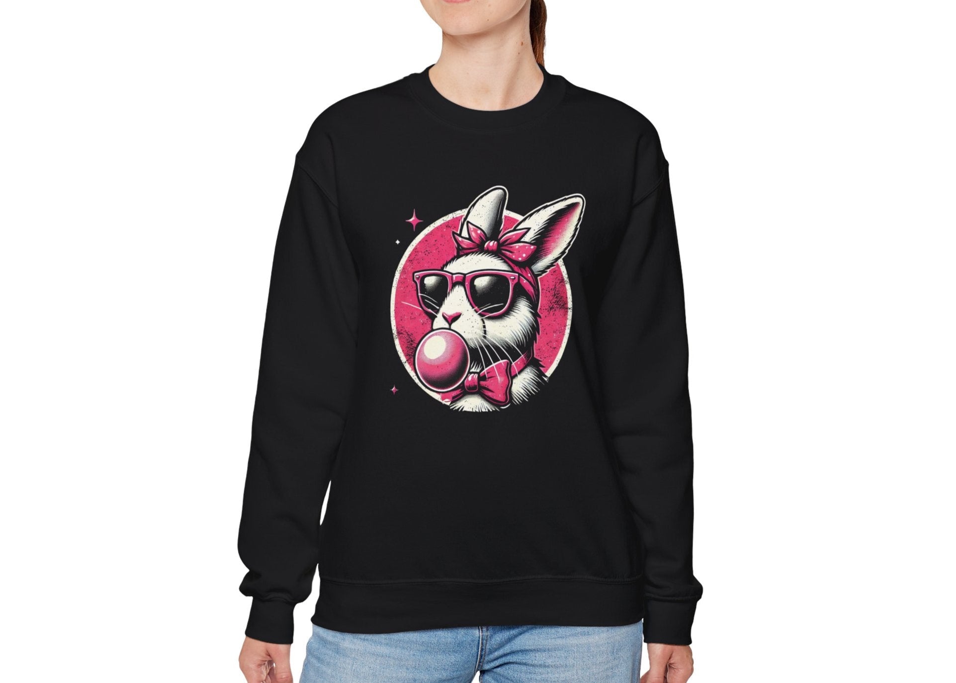 Woman wearing black sweater jumper with retro Easter bunny blowing pink bubblegum. Part of the Vivid Divergence Sensory Friendly Unisex Sweater Jumper Range.
