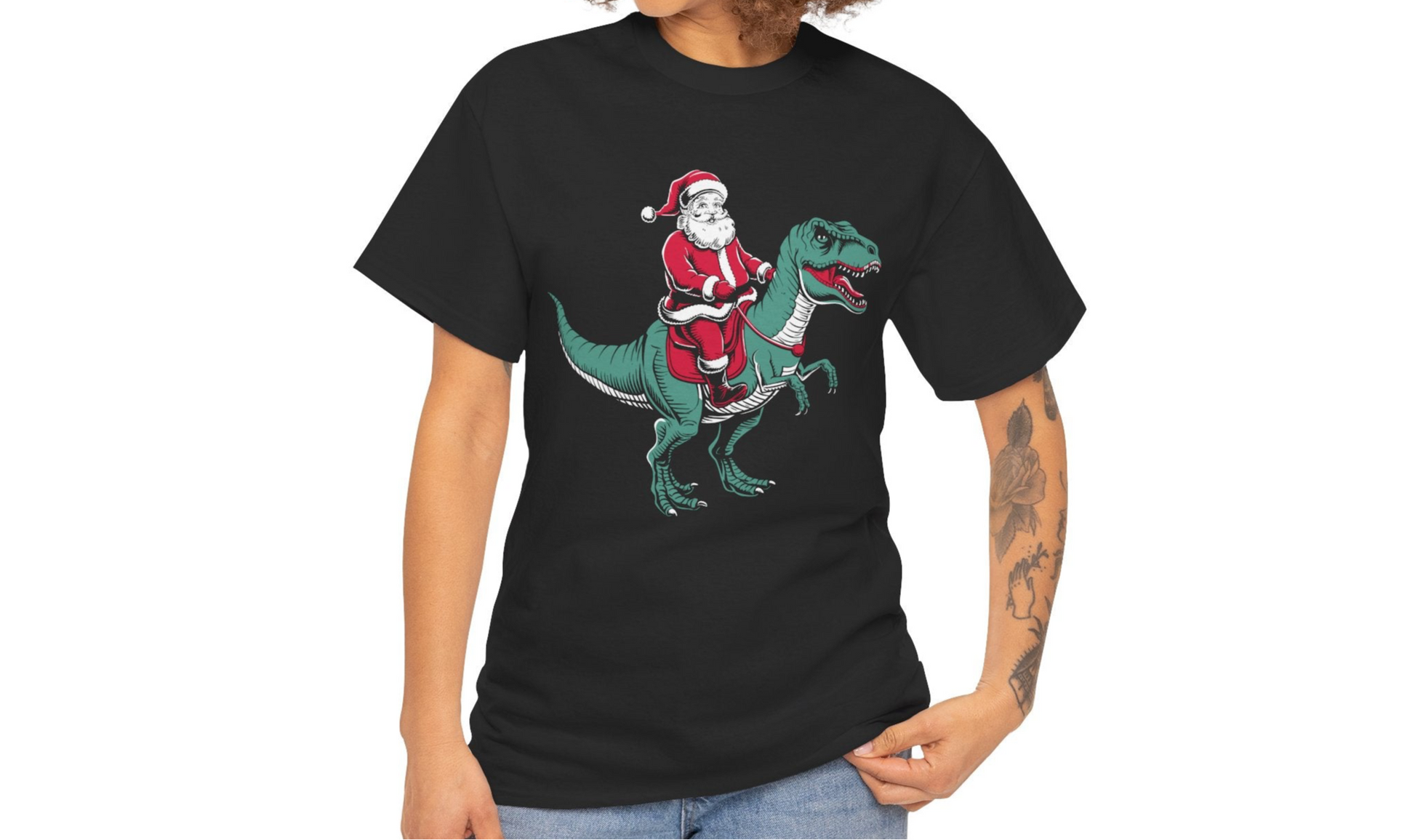 Model wearing a black T-shirt with a fun Christmas-themed illustration of Santa riding a dinosaur. Part of the Vivid Divergence Sensory Friendly Unisex Tees Range.
