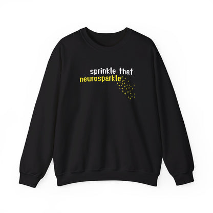 Front view of a black sweater jumper with the text "Sprinkle That Neurosparkle" in yellow and white lettering, surrounded by sparkling star graphics. Part of the Vivid Divergence Sensory Friendly Unisex Sweater Jumper Range.