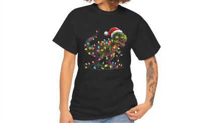 Model wearing a black T-shirt featuring a holiday T-Rex wrapped in Christmas lights with a Santa hat. Part of the Vivid Divergence Sensory Friendly Unisex Tees Range.