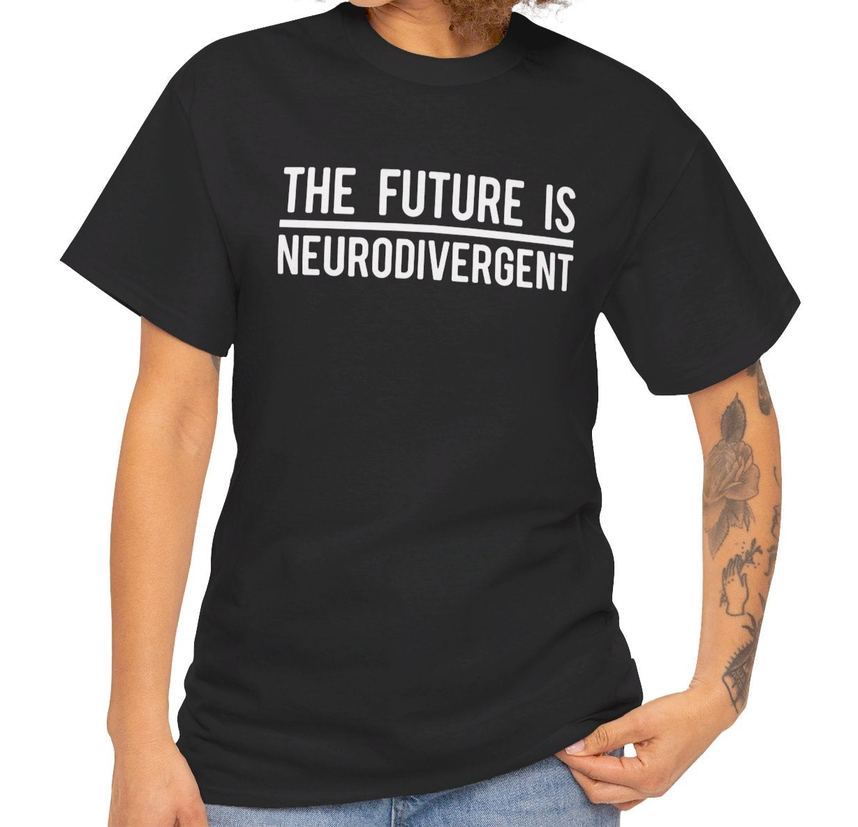Model wearing a black T-shirt with the text "The Future is Neurodivergent" in bold white letters. Part of the Vivid Divergence Sensory Friendly Unisex Tees Range.