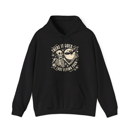 Front view of a black hoodie featuring the text "There It Goes, My Last Flying F*ck" with a cartoon illustration of a flying bird holding a banner. Part of the Vivid Divergence Sensory Friendly Unisex Hoodie Range.