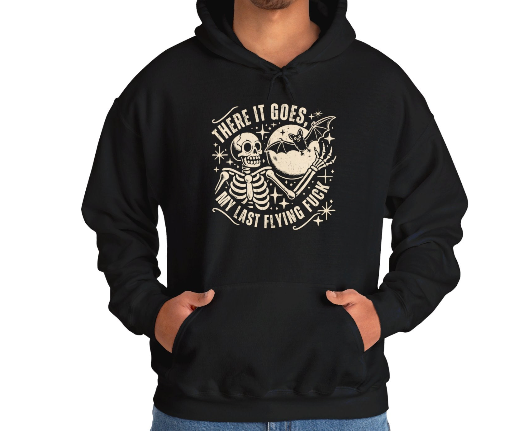 Model wearing a black hoodie featuring the text "There It Goes, My Last Flying F*ck" with a cartoon illustration of a flying bird holding a banner. Part of the Vivid Divergence Sensory Friendly Unisex Hoodie Range.