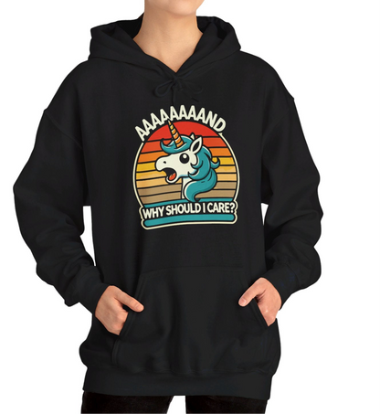 Model wearing a black hoodie with a "Aaaaand Why Should I Care?" text and unicorn rainbow retro graphic. Part of the Vivid Divergence Sensory Friendly Unisex Hoodie Range.