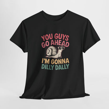 Hanging black T-shirt featuring "You Guys Go Ahead, I'm Gonna Dilly Dally" text in a retro 90s-style font with a snail illustration. Part of the Vivid Divergence Sensory Friendly Unisex Tees Range.