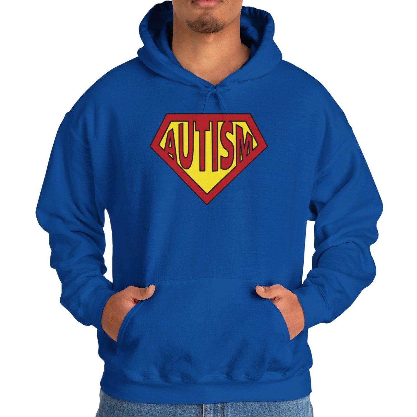 Model wearing a blue hoodie featuring the text "Autism" inside a Superman-style red and yellow shield design. Part of the Vivid Divergence Sensory Friendly Unisex Hoodie Range.