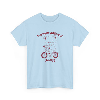 Front view of a blue T-shirt featuring the "Built Different (Badly)" bear design. Part of the Vivid Divergence Sensory Friendly Unisex Tees Range.